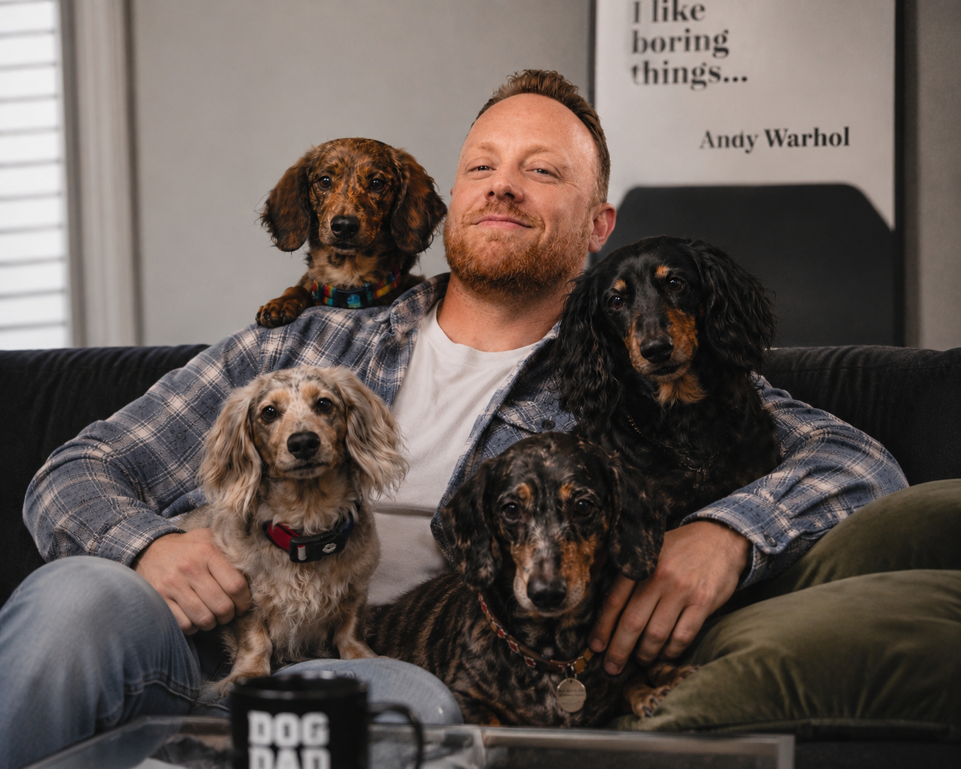 Ryan on the couch with his five dachshunds at home in Canton, GA